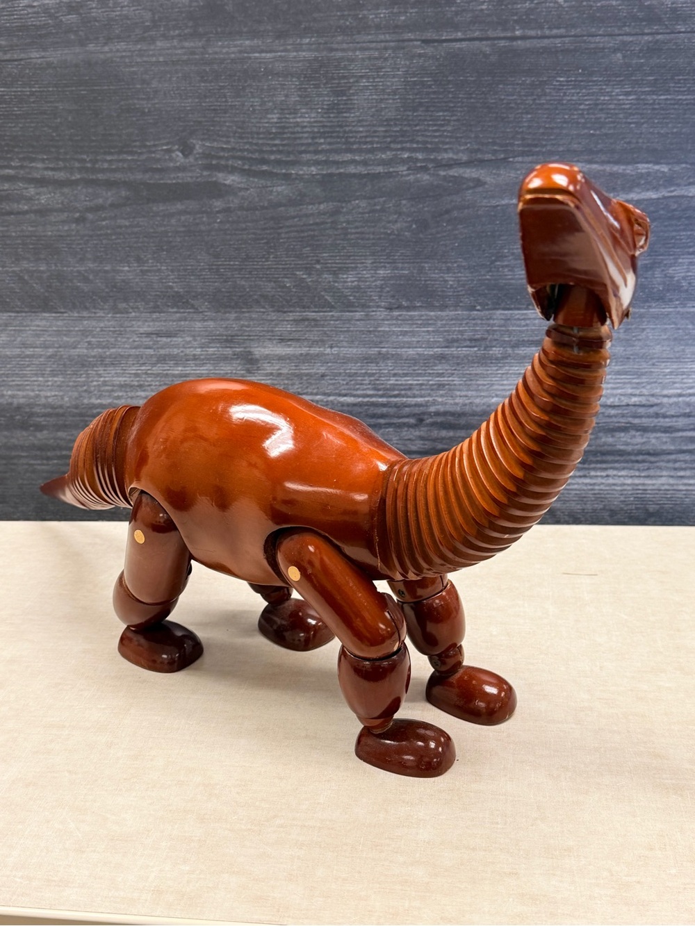 Manikin Sauropod articulating figurine wood